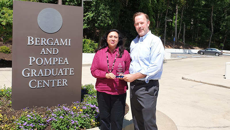 Ranjana Maitra '91 MBA and Dr. Brian Kench, dean of the University’s Pompea College of Business, at the University’s Orange Campus.
