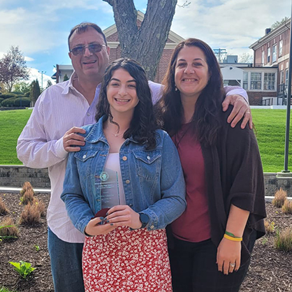 Justine Valentino ’24 with her parents George and Lauren Valentino after Justine received the Charles Vigue Award for Excellence in Research.