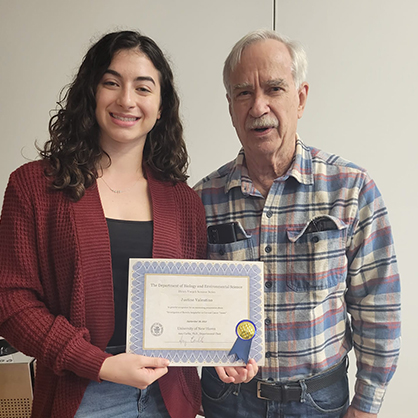 Justine Valentino ’24 with Henry Voegeli after the Voegeli Seminar. Valentino presented her Honors thesis focusing on cervical cancer and Lyme disease.