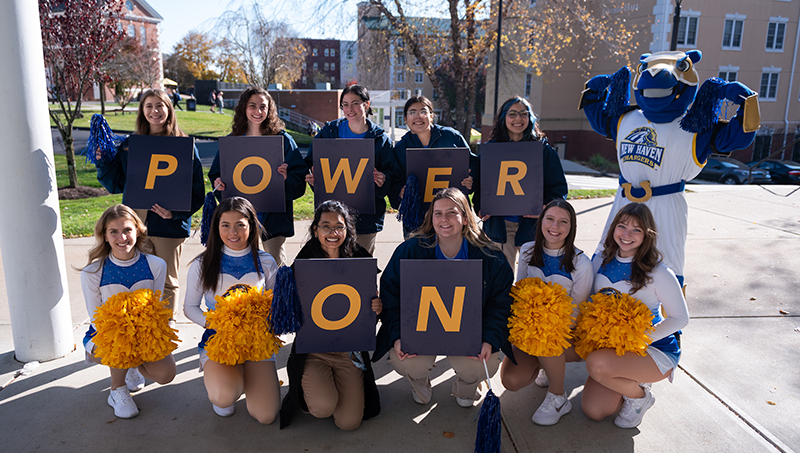 Charlie and students celebrate the new “power on” brand.