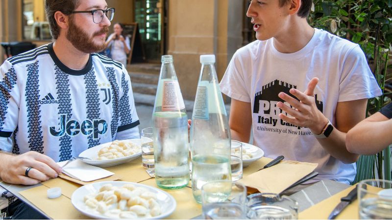 Liam Orsini ’24 (left) and Noah Iott ’25 enjoy gnocchi at Caffè Buonamici.