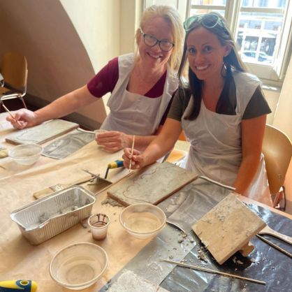 Lorraine Longing (left) and Danielle Avery enjoy the fresco painting workshop.