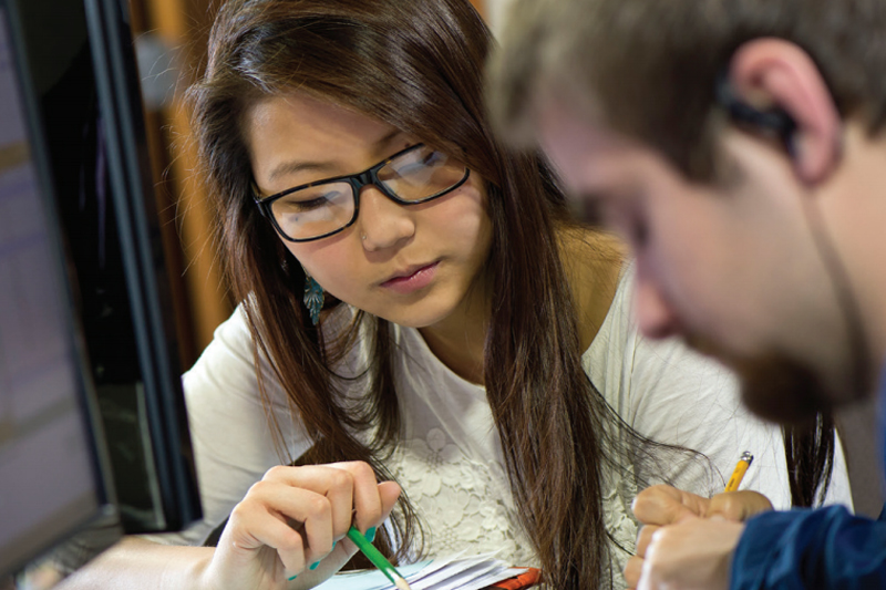 Woman studying something on paper