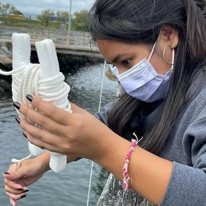 Nataly Urgiles ’25 at Long Wharf Pier in New Haven as part of her introduction to marine biology course.