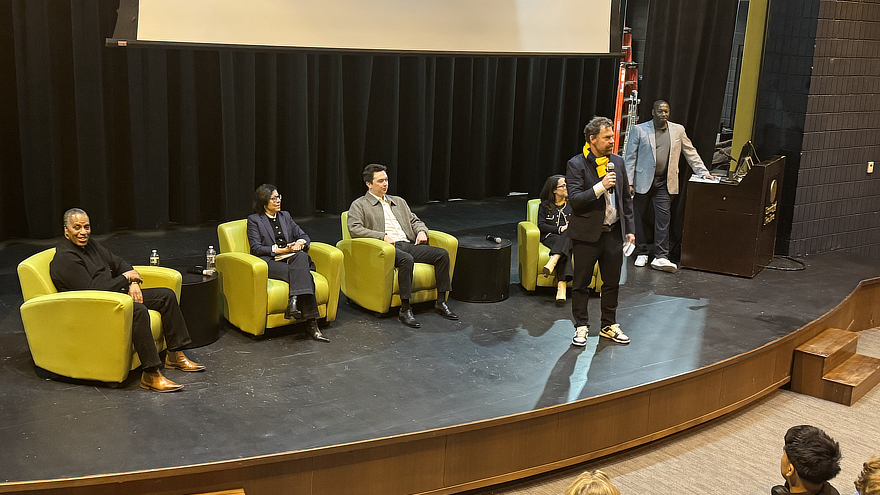 Jens Frederiksen on stage with panel