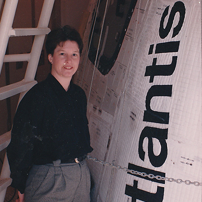 Ann Cox ’83 on the launch pad beside the Atlantis.