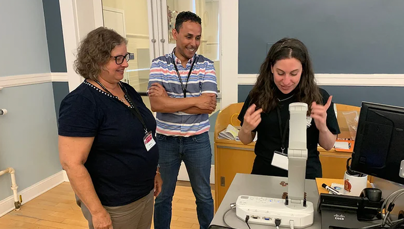 Prof. Liberty Page (left), Dr. Mehdi Mekni, and Laura Brown '27 M.S. at the GenCyber Teacher Academy in 2023.