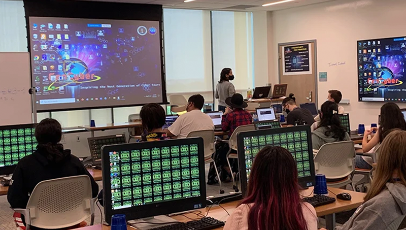 High school students learning about cybersecurity at the University in 2021.