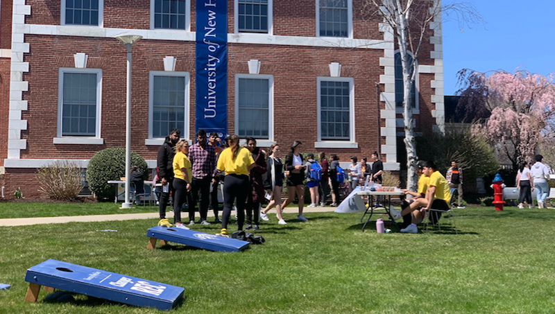 Students playing lawn games on the green.