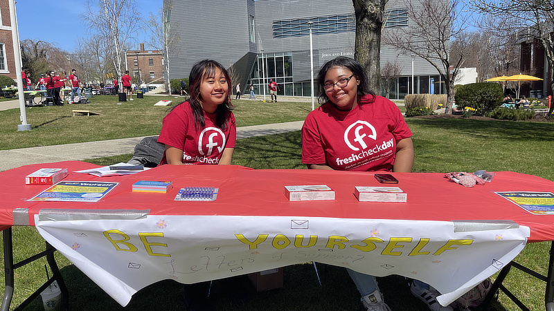 Students at the Letters of Support table.