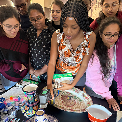 MPH candidate Edith Nkalubo uses an X-ray fluorescence analyzer to detect lead from various objects