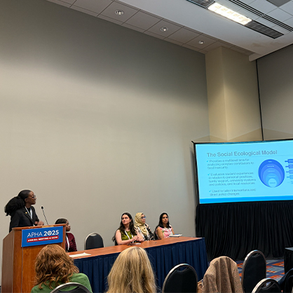 Jamesha Barrett '26 MPH describes the Social Ecological Model as part of her award-winning research presentation 