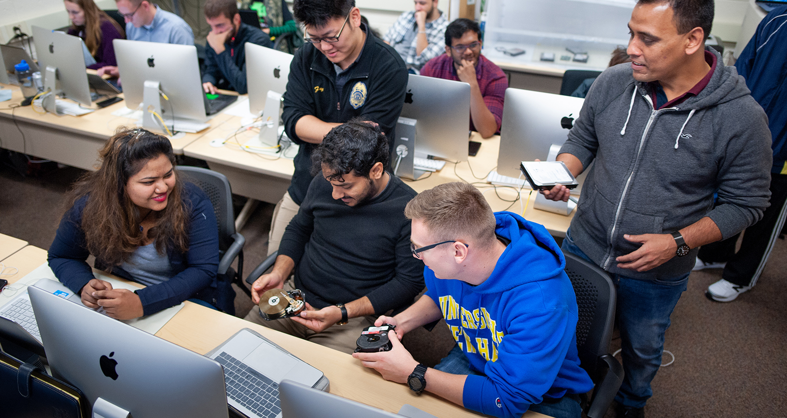 Image of students in an engineering/computing lab