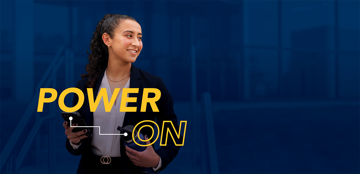 Power On graphic over a smiling student on a dark blue background.