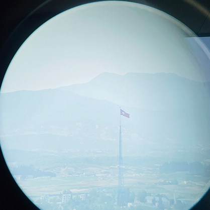 Photo of a North Korean flag post through binoculars at the Dora Observatory