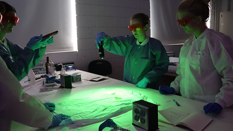 Students used alternate light sources and Luminol to reveal hidden biological evidence