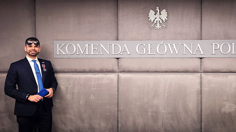 Patryk Jaroszkiewicz '16, '20 M.S. wearing the Silver Medal of Merit