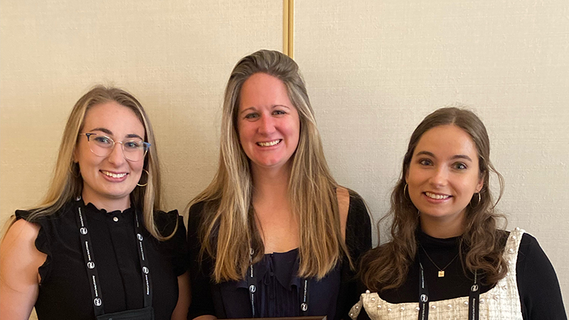 Stephanie Bonnes, Ph.D. (center) received the American Society of Criminology’s “Inconvenient Woman of the Year” Award, while two of her Ph.D. students also earned national honors for their research.