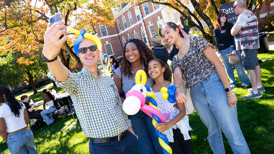 Family taking selfie with baloons