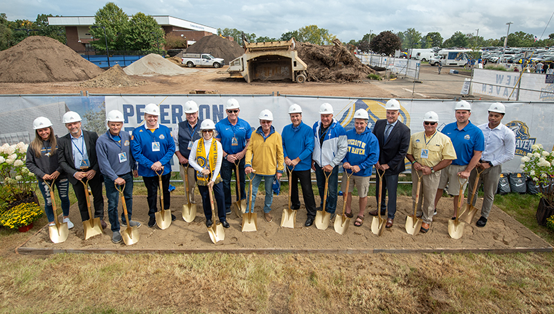 University representatives with shovels, at the site where the Performance Center will be built.