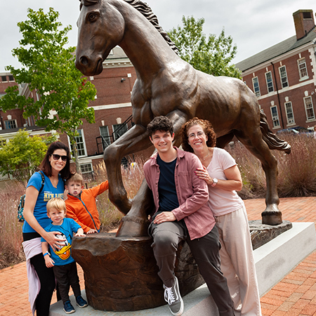 Families took photos together at the Charger statue on campus.