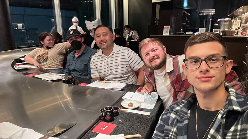 Dr. Chris Haynes (center) and students in Japan.