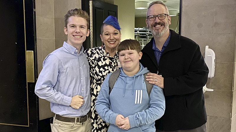 Carolyn Kielma ’02 M.S. with her sons Ryan (left) and Henry and her husband Michael at the Connecticut Teacher of the Year ceremony. 