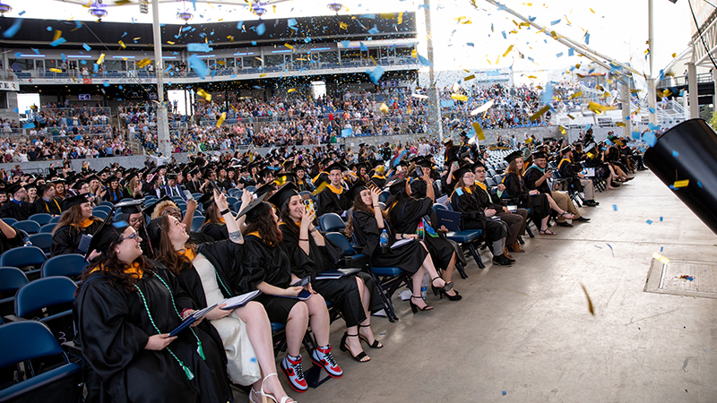 The ceremony wrapped up with lots of smiles – and blue and gold confetti.