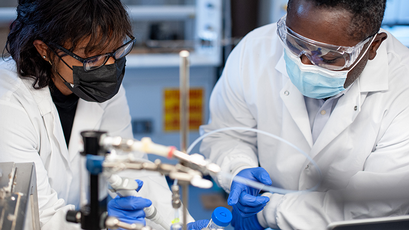 Kagya Amoako, Ph.D. (right) creates hands-on research opportunities for his students.