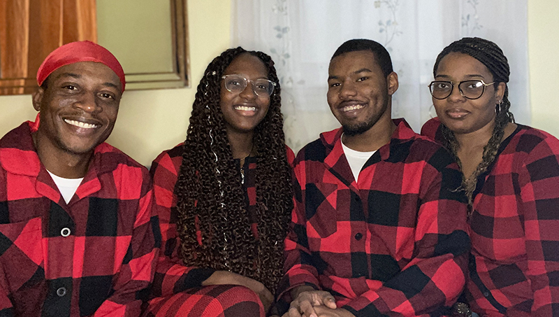 Timothy Prince (second from right) celebrates Christmas with his parents and younger sister.