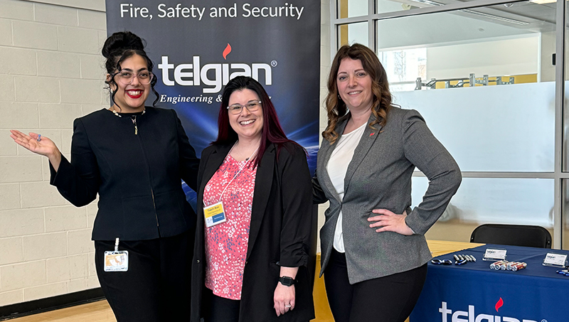 Telgian employees pose for a photo at the career fair.