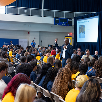Athletics Director Devin Crosby brought high energy, celebrating the start of the University’s NCAA Division I era
