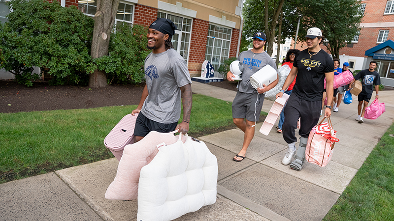 Student-athletes pitched in to help families carry items into the residence halls