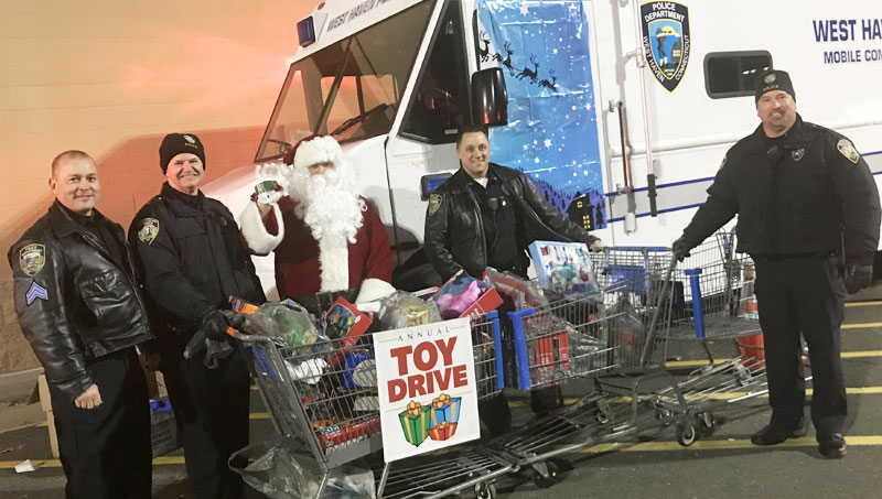 Image of both police departments at a Toys for Tots drive