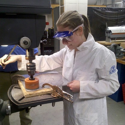 Image of Amanda Scalza ’12 working on a project at the University. 