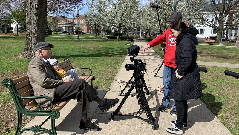 Students filming on the West Haven Green.