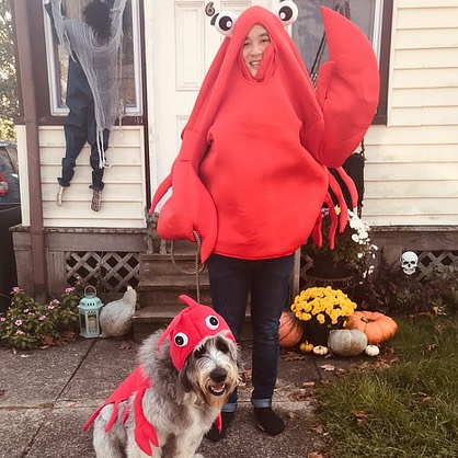 Image of Colby Thammavongsa and his dog dressed for halloween.