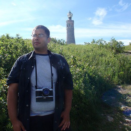 Image of Robert Velez taking photographs in Massachusetts.