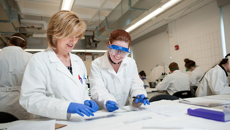 Virginia Maxwell and student in lab