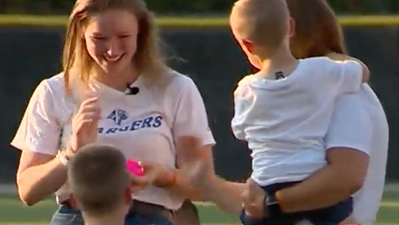 Rachel buck with Jacob's family at a baseball game