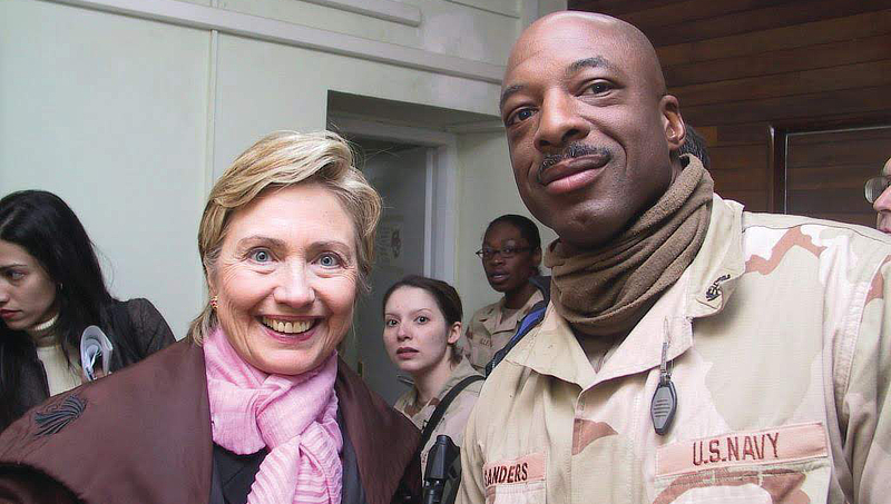 Dr. Robert Sanders and former U.S. Secretary of State Hillary Clinton.