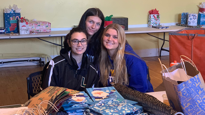 Chargers gathered to wrap gifts for local families.