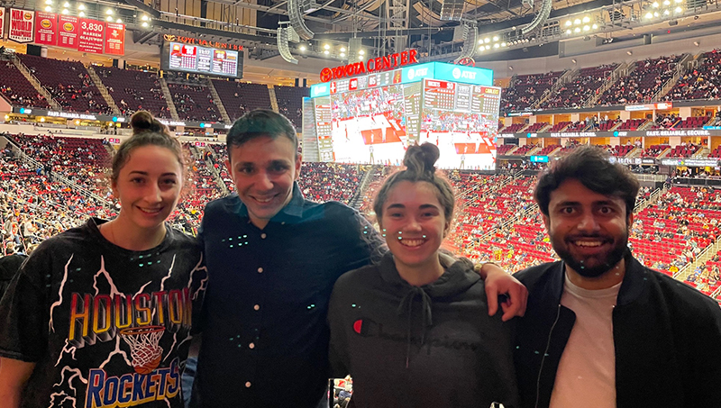 Group image of, left to right: Left to right: Keira Integlia, Andreas Xenofontos, Josie Schmidt and Mohammed Anas Ali during a Houston Rockets game.