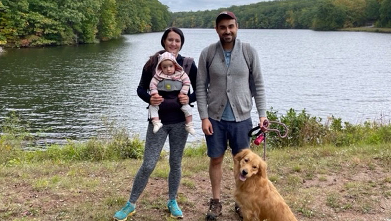 Laura Miller with her husband, daughter, and dog Sandwich.