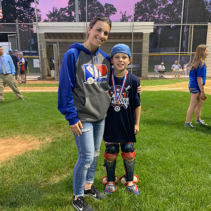 Image of Jessica Scibek with her son after his baseball game.
