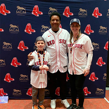 Image of Jessica Scibek and her son meeting Pedro Martinez at Red Sox Winter Weekend.
