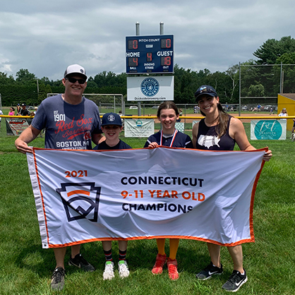 Image of Jessica Scibek, her husband Eric, and their son and daughter after a softball game.