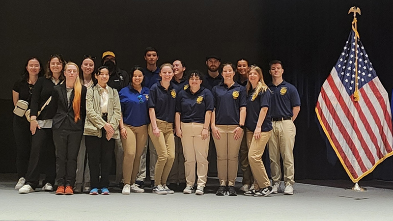 The American Criminal Justice Association and Graduate Forensic Science Club on the FBI Academy’s auditorium stage.