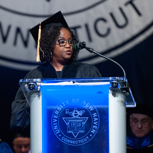 Photo of Regina Rush-Kittle speaking at the afternoon commencement ceremony