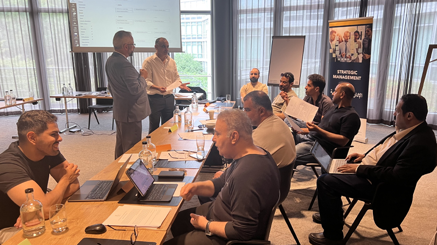 Executives view a presentation.